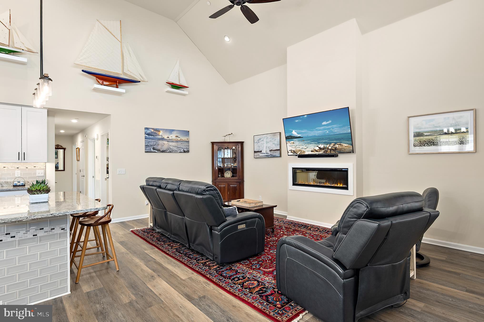 144 Clamshell Road Ocean City, MD 21842 - Photo 10 of 64 a living room with furniture a flat screen tv and kitchen view
