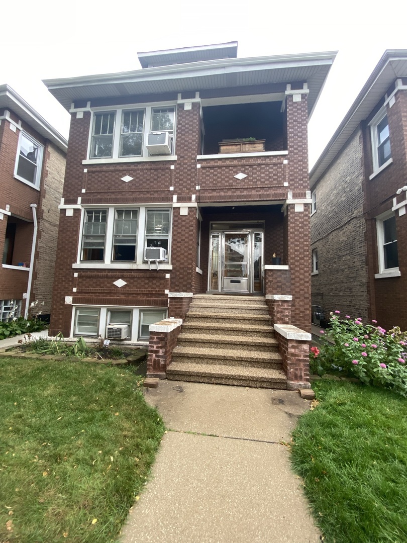 4818 South Springfield Avenue Chicago, IL 60632 - Photo 26 of 36 a front view of a house with a yard
