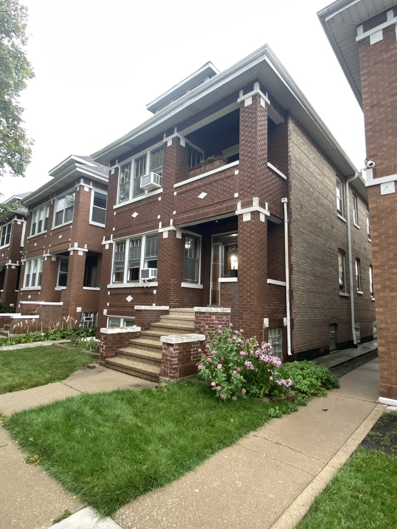 4818 South Springfield Avenue Chicago, IL 60632 - Photo 27 of 36 a front view of a house with a yard