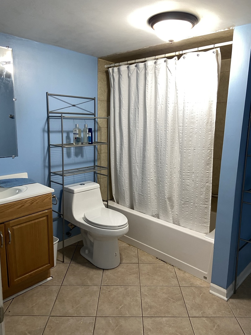 4818 South Springfield Avenue Chicago, IL 60632 - Photo 35 of 36 a bathroom with a toilet and a shower