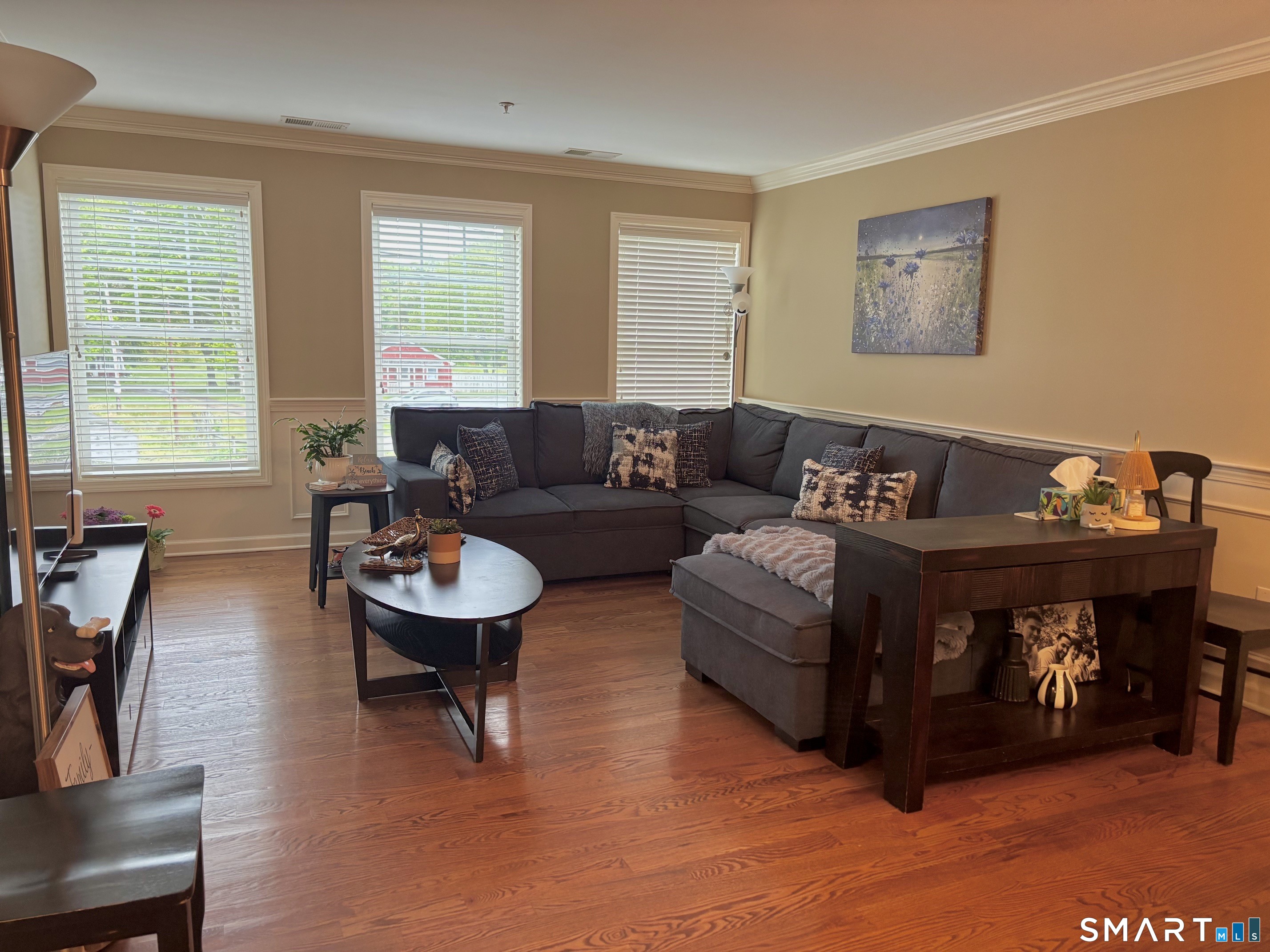 67 West Main Street, Unit 122 Clinton, CT 06413 - Photo 11 of 14 a living room with furniture and a large window