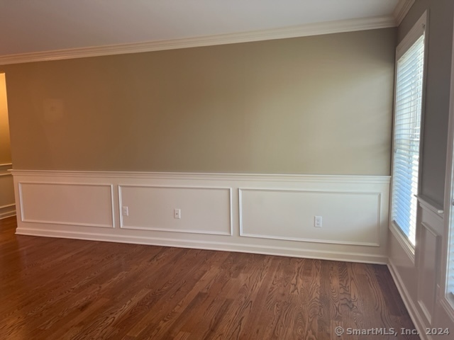 67 West Main Street, Unit 122 Clinton, CT 06413 - Photo 12 of 14 a view of an empty room and wooden floor