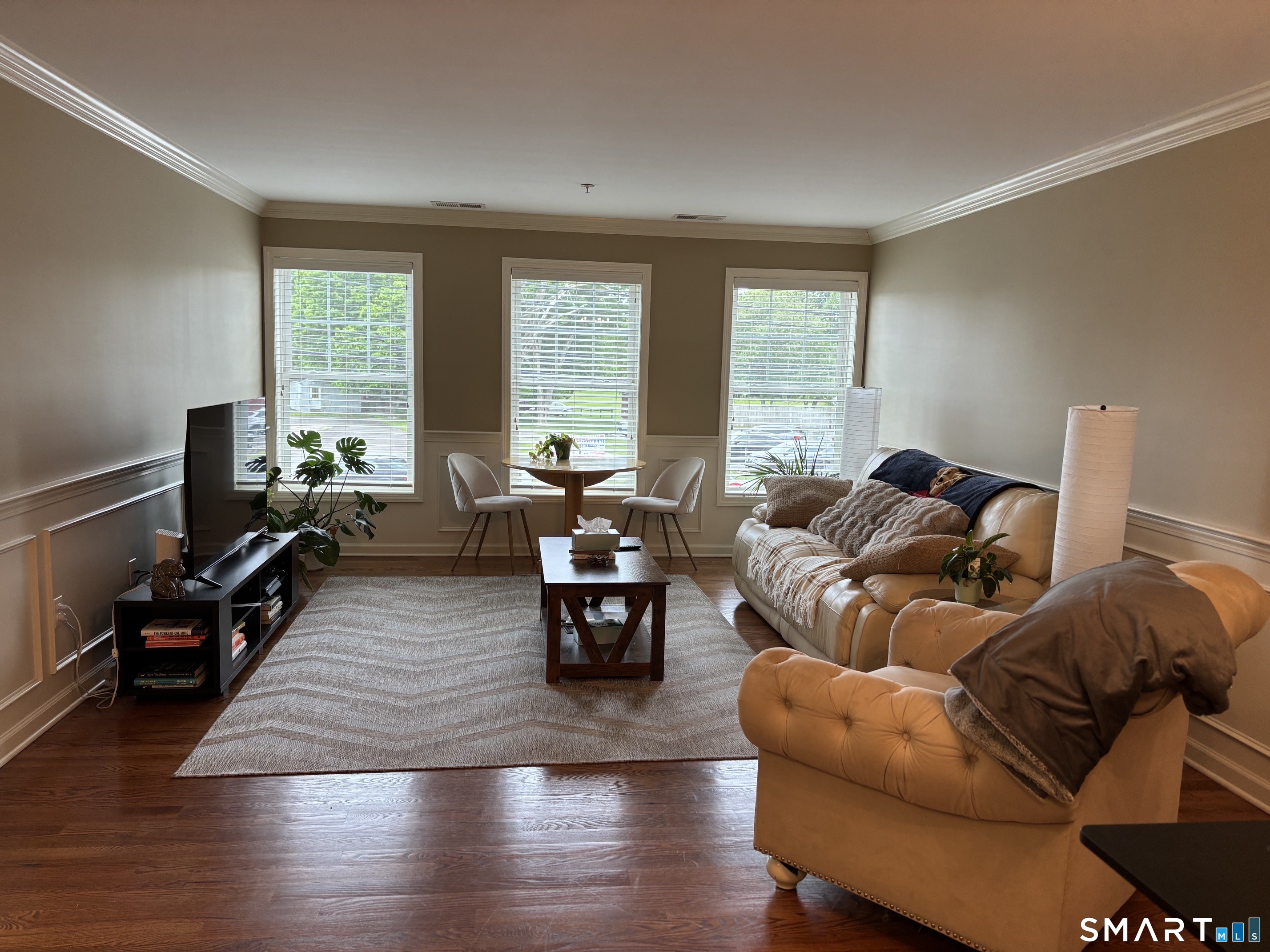 67 West Main Street, Unit 122 Clinton, CT 06413 - Photo 2 of 14 a living room with furniture window and wooden floor