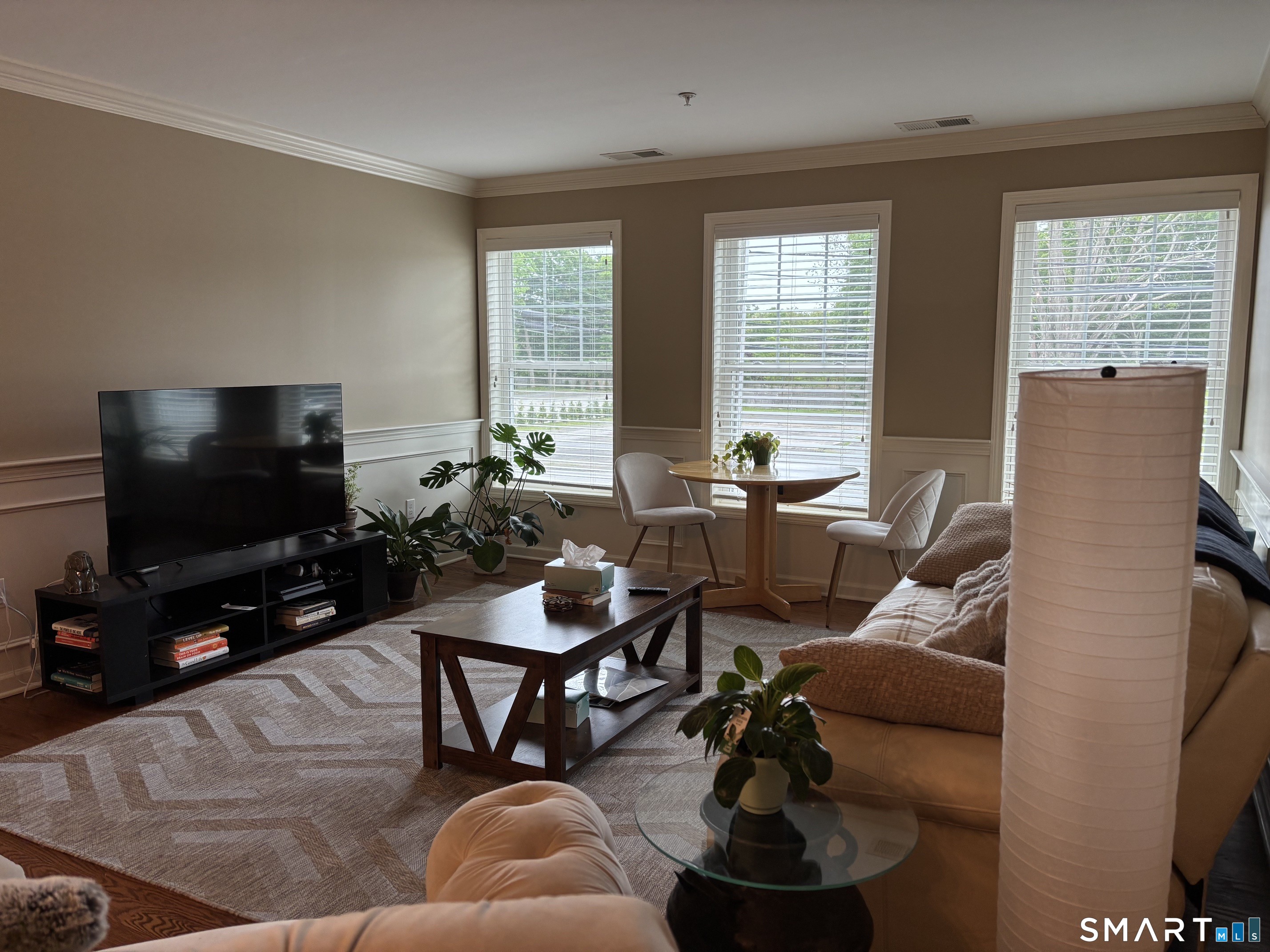 67 West Main Street, Unit 122 Clinton, CT 06413 - Photo 4 of 14 a living room with furniture and a flat screen tv