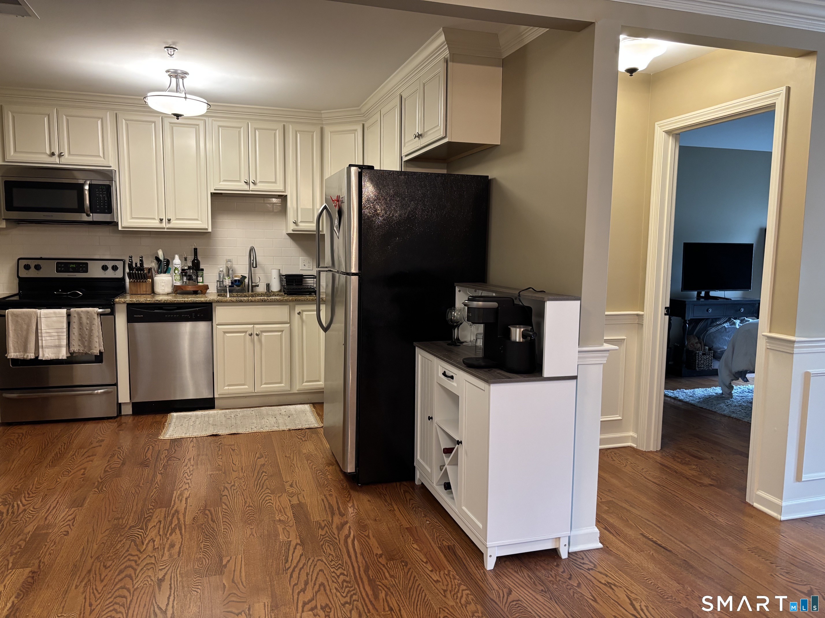 67 West Main Street, Unit 122 Clinton, CT 06413 - Photo 8 of 14 a kitchen with granite countertop a refrigerator stove top oven and sink