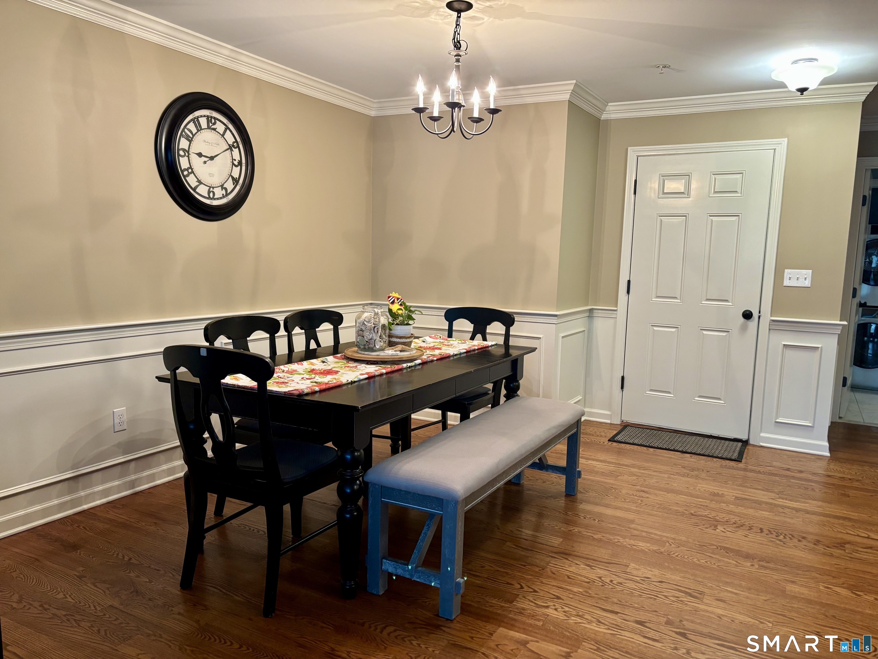 67 West Main Street, Unit 122 Clinton, CT 06413 - Photo 9 of 14 a view of a dining room with furniture and wooden floor