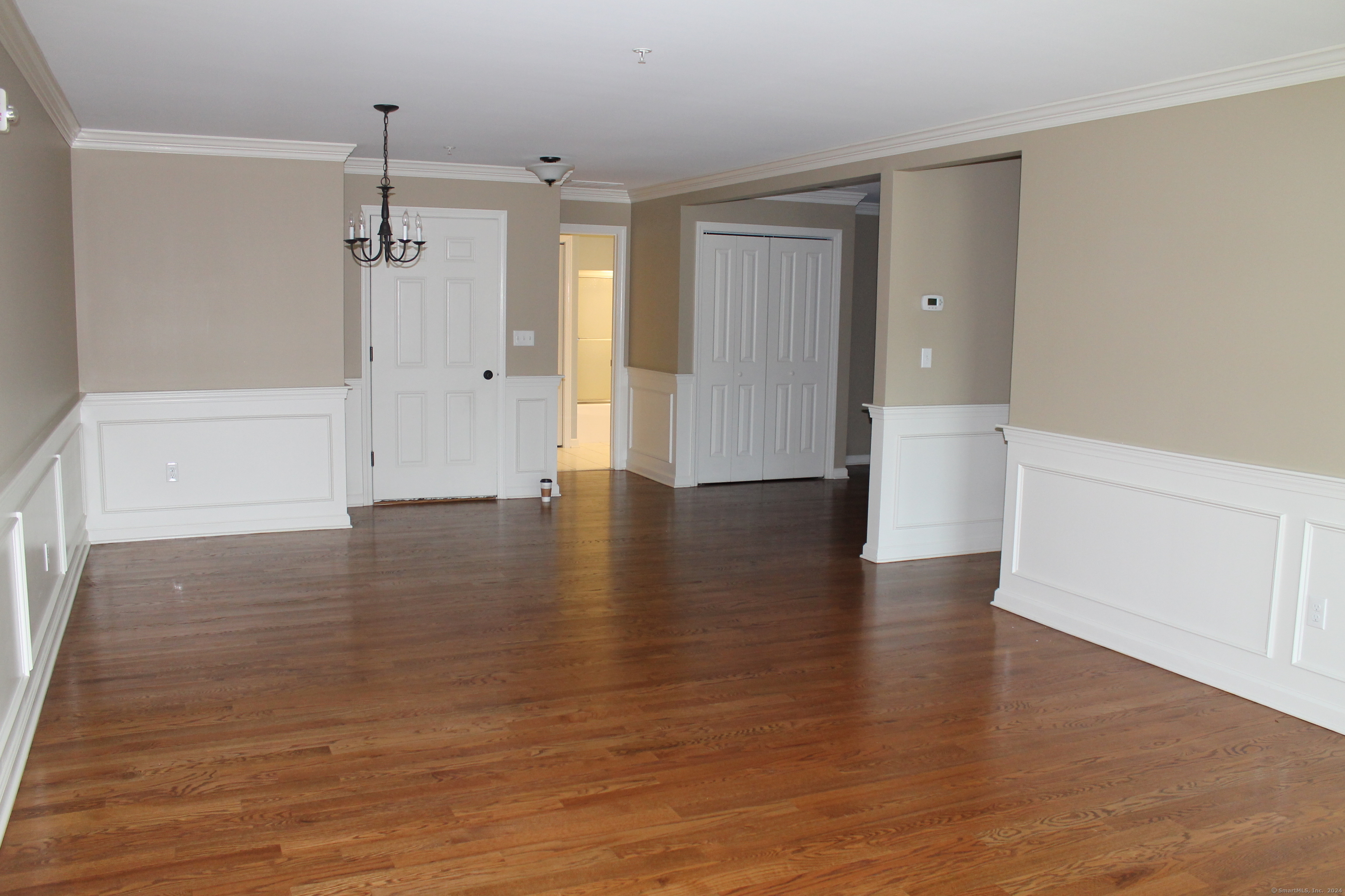 67 West Main Street, Unit 122 Clinton, CT 06413 - Photo 10 of 14 a view of empty room with wooden floor
