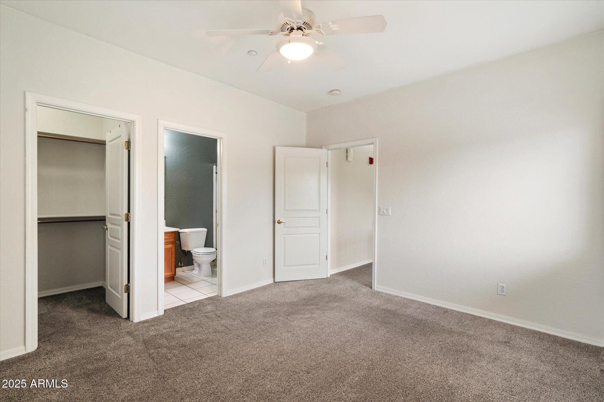 2019 East Campbell Avenue, Unit 125 Phoenix, AZ 85016 - Photo 16 of 21 a view of a room with a ceiling fan and entryway