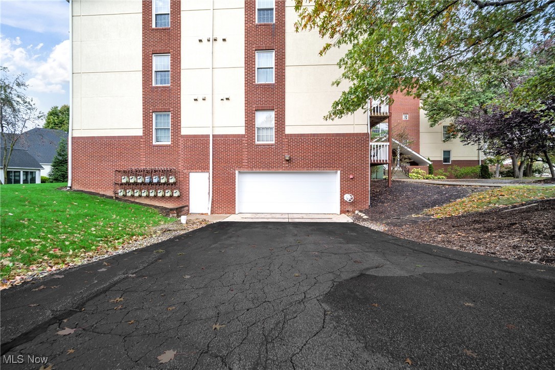 22481 Center Ridge Road, Unit 202 Rocky River, OH 44116 - Photo 22 of 24 View of property with a garage