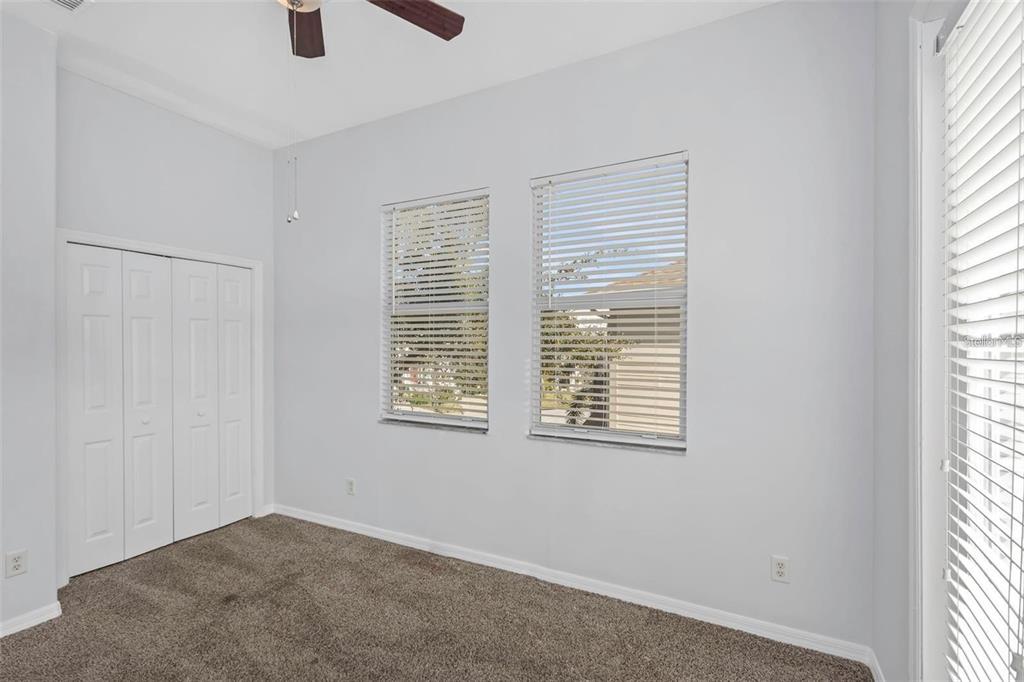 7327 Brightwaters Court New Port Richey, FL 34652 - Photo 28 of 45 an empty room with windows