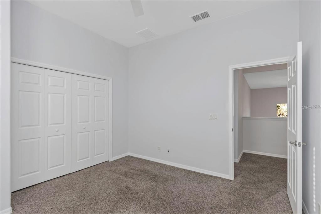 7327 Brightwaters Court New Port Richey, FL 34652 - Photo 30 of 45 a view of an empty room and closet area