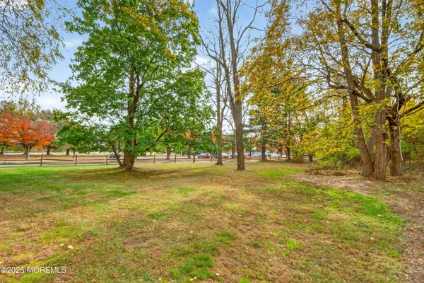 a backyard of apartments with large trees
