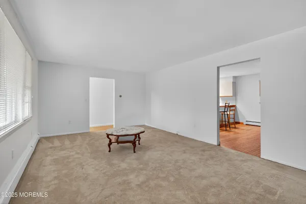 a view of kitchen with stainless steel appliances granite countertop refrigerator oven a sink and dishwasher with wooden floor
