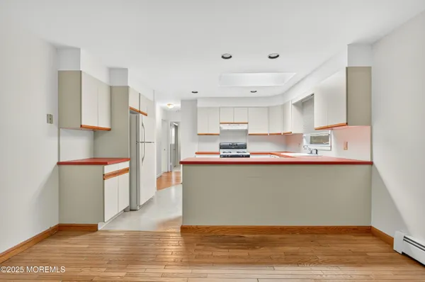 a kitchen with counter top space and cabinets