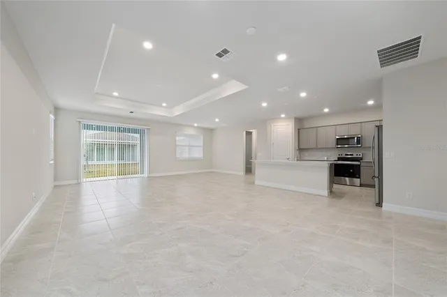 a view of an empty room with a window