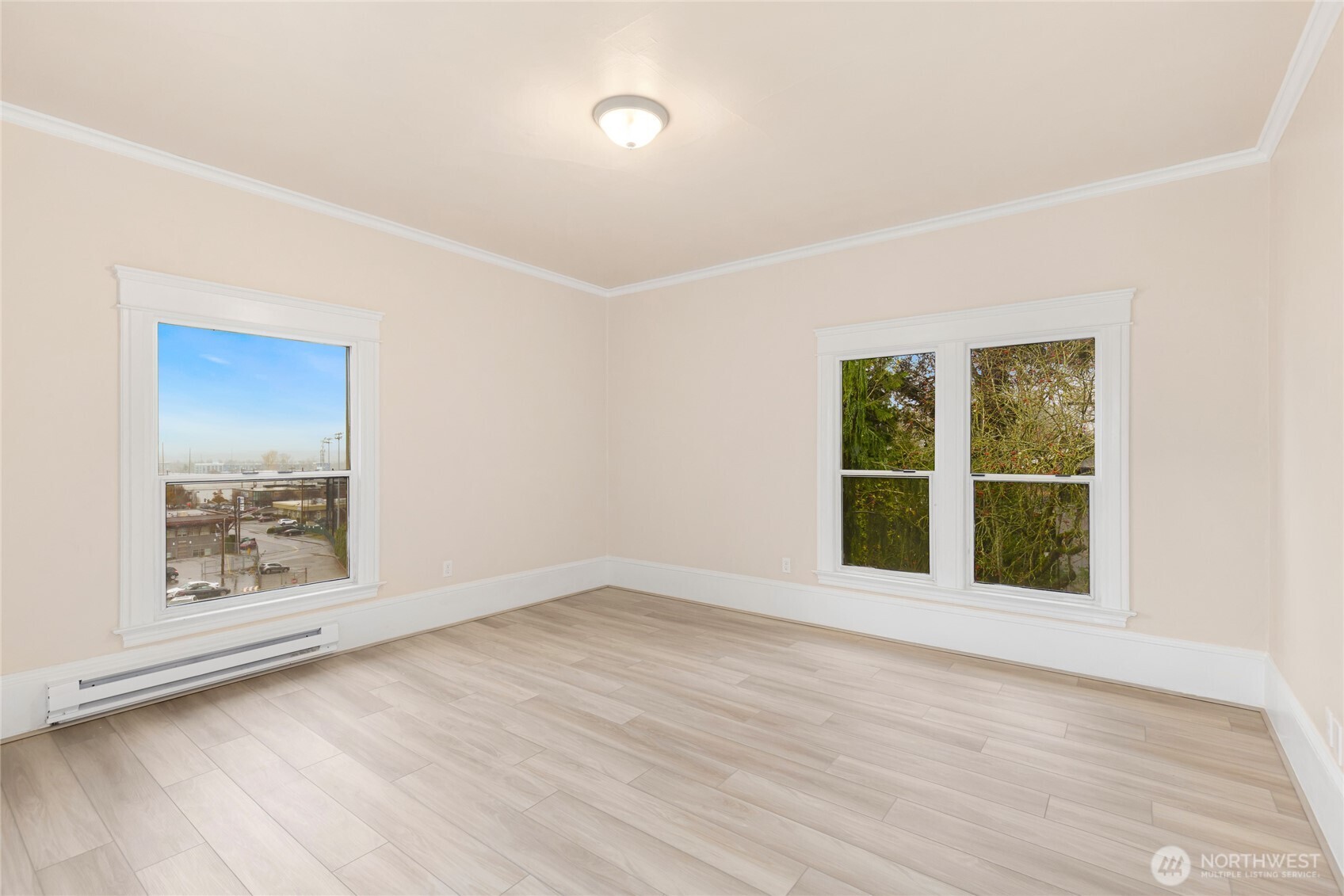 3722 Oakes Avenue Everett, WA 98201 - Photo 26 of 27 an empty room with wooden floor and windows