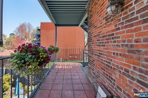 a view of a pathway both side of house