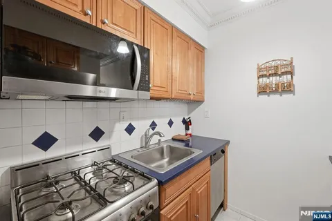 a kitchen with a stove and a microwave