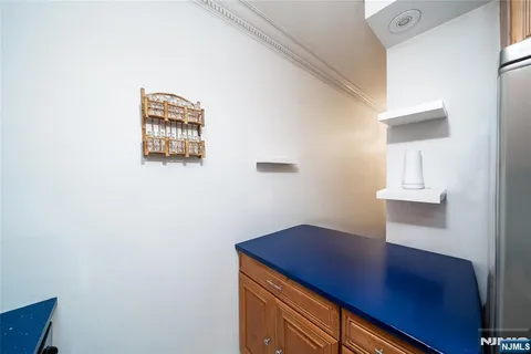 a kitchen with stainless steel appliances a stove a microwave and cabinets