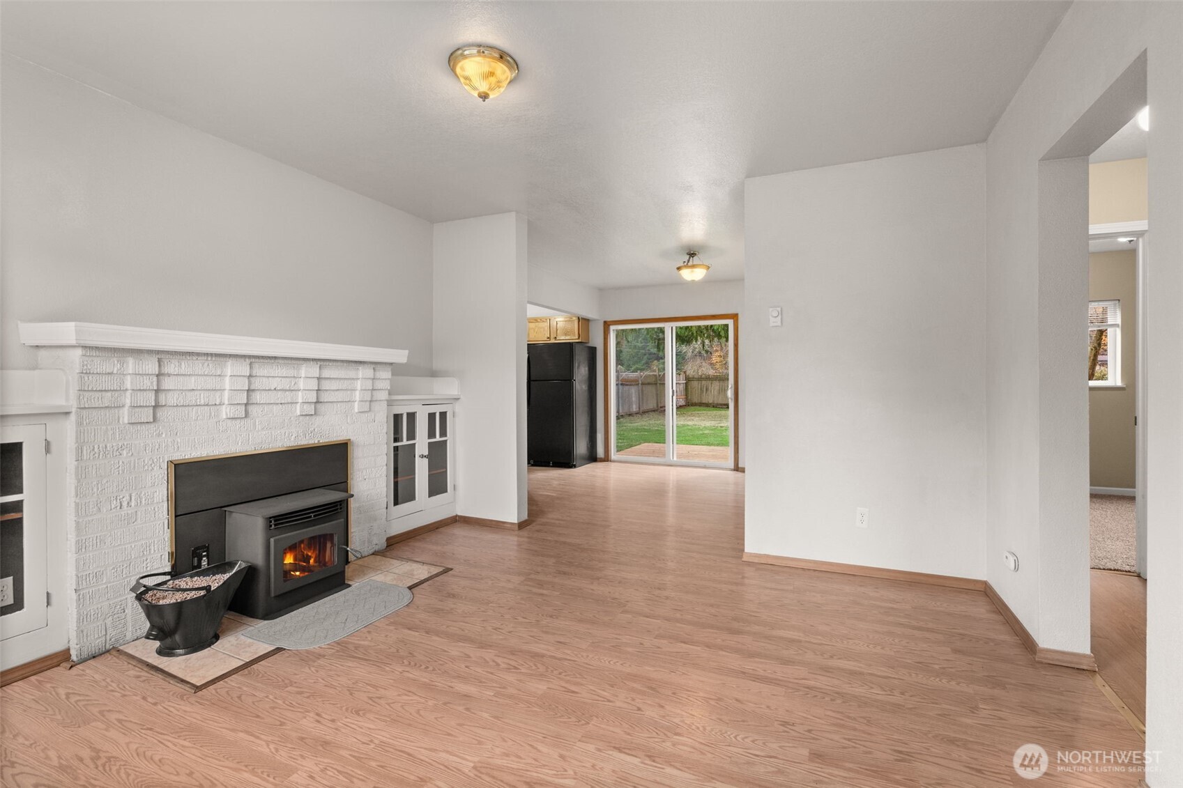 600 South Diamond Street Centralia, WA 98531 - Photo 11 of 34 a view of an empty room with a fireplace and a window