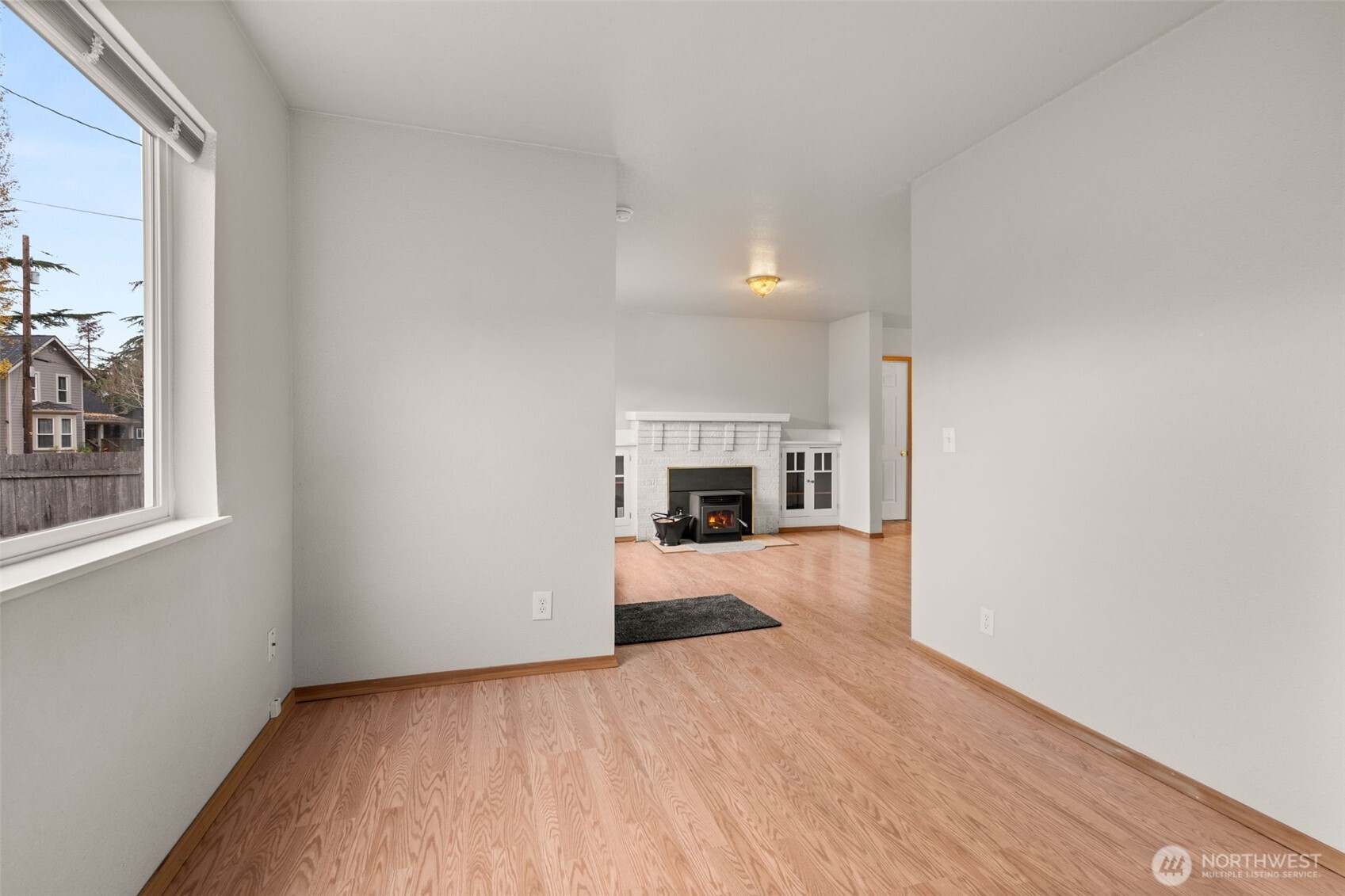 600 South Diamond Street Centralia, WA 98531 - Photo 14 of 34 a view of a livingroom with a fireplace and a window