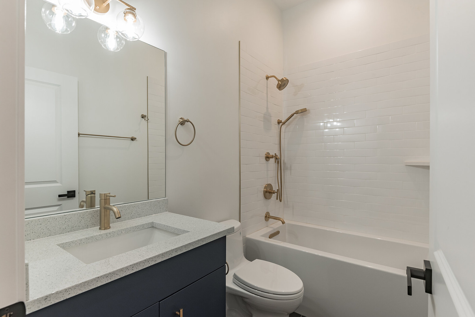 2714 West Cortez Street, Unit 3 Chicago, IL 60622 - Photo 6 of 22 a bathroom with a sink a toilet and shower