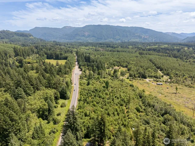 a view of a town with mountains in the background