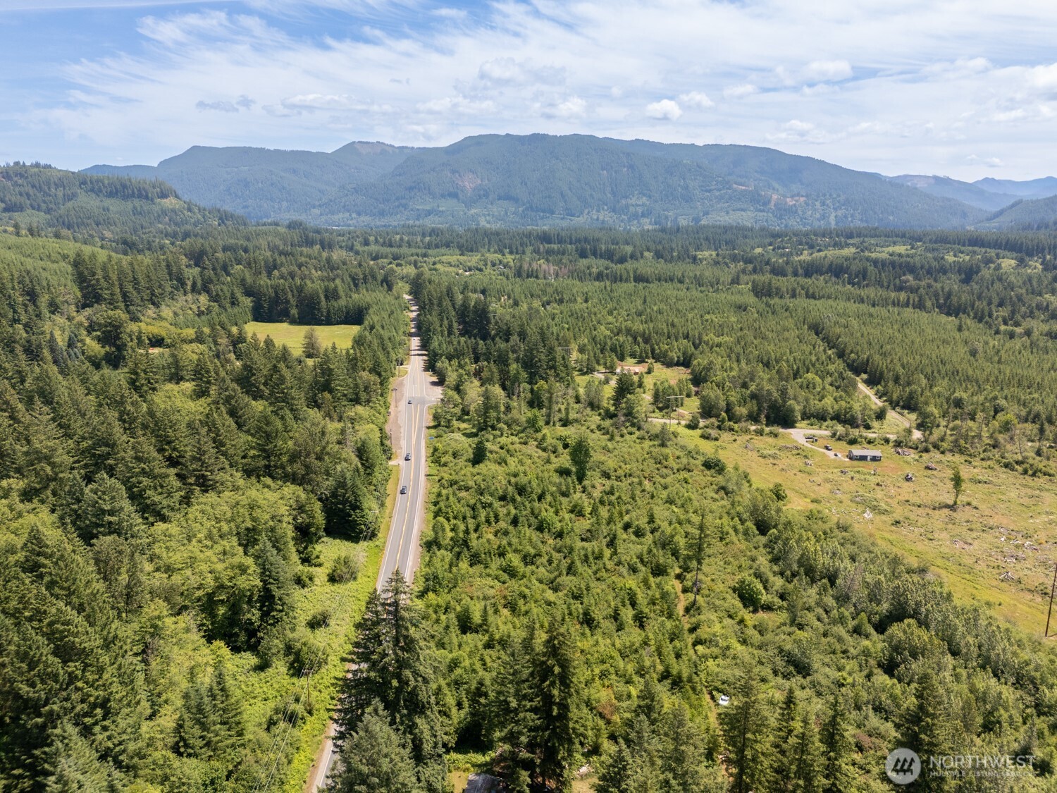 a view of a town with mountains in the background