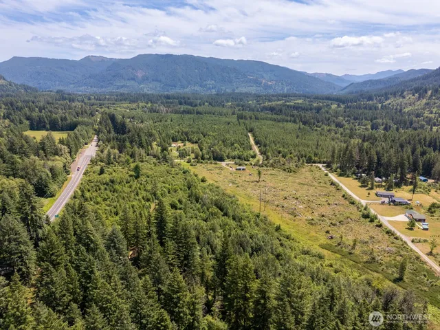 a view of a town with mountains in the background