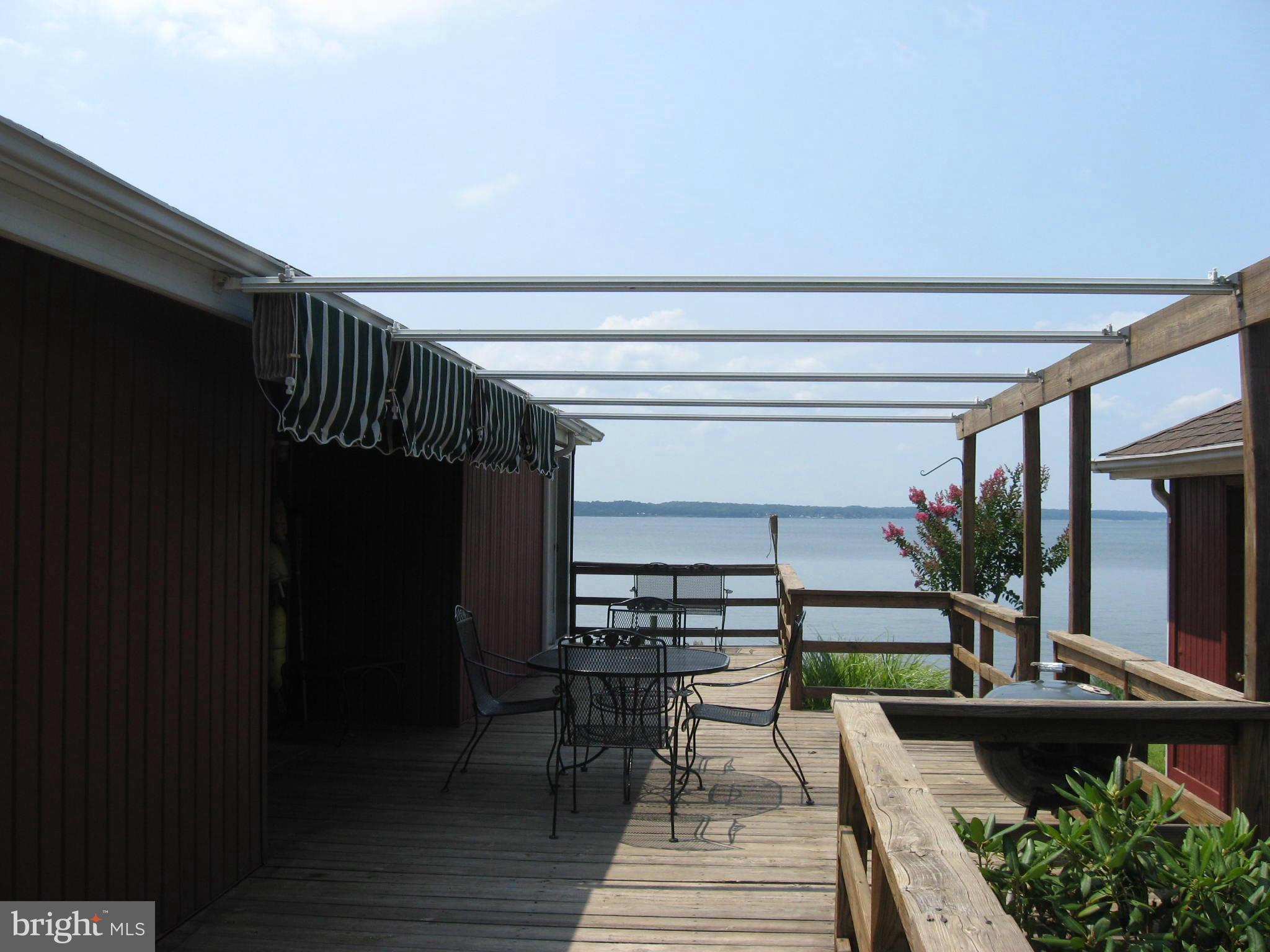9395 River View Road Broomes Island, MD 20615 - Photo 3 of 22 Deck with awning and fabulous views