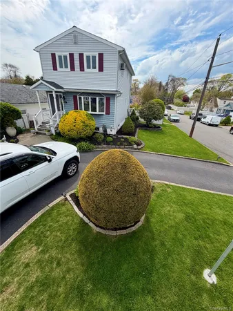 a view of multiple houses with a yard