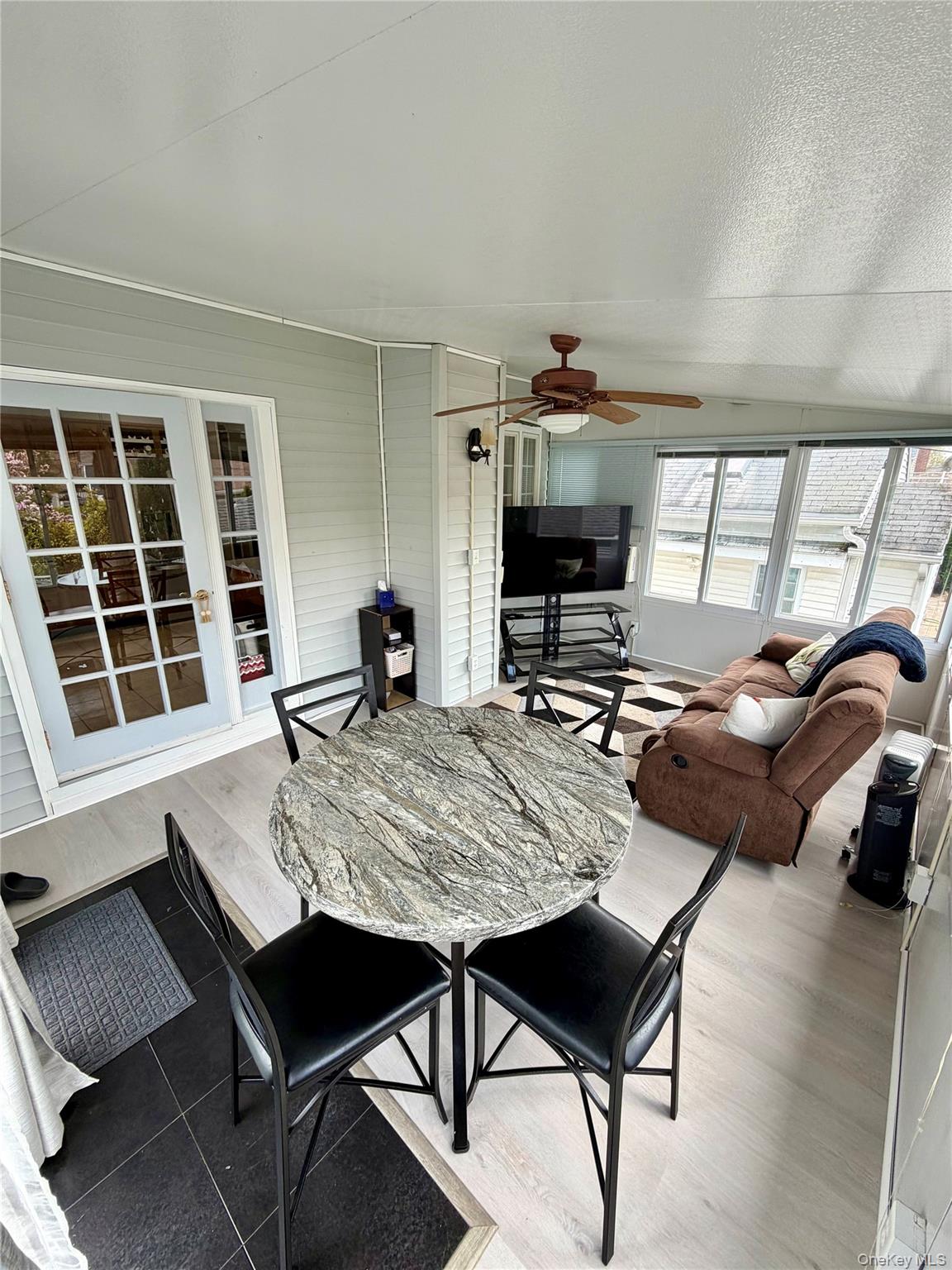 27 Colonial Road Copiague, NY 11726 - Photo 12 of 15 a view of a dining room with furniture