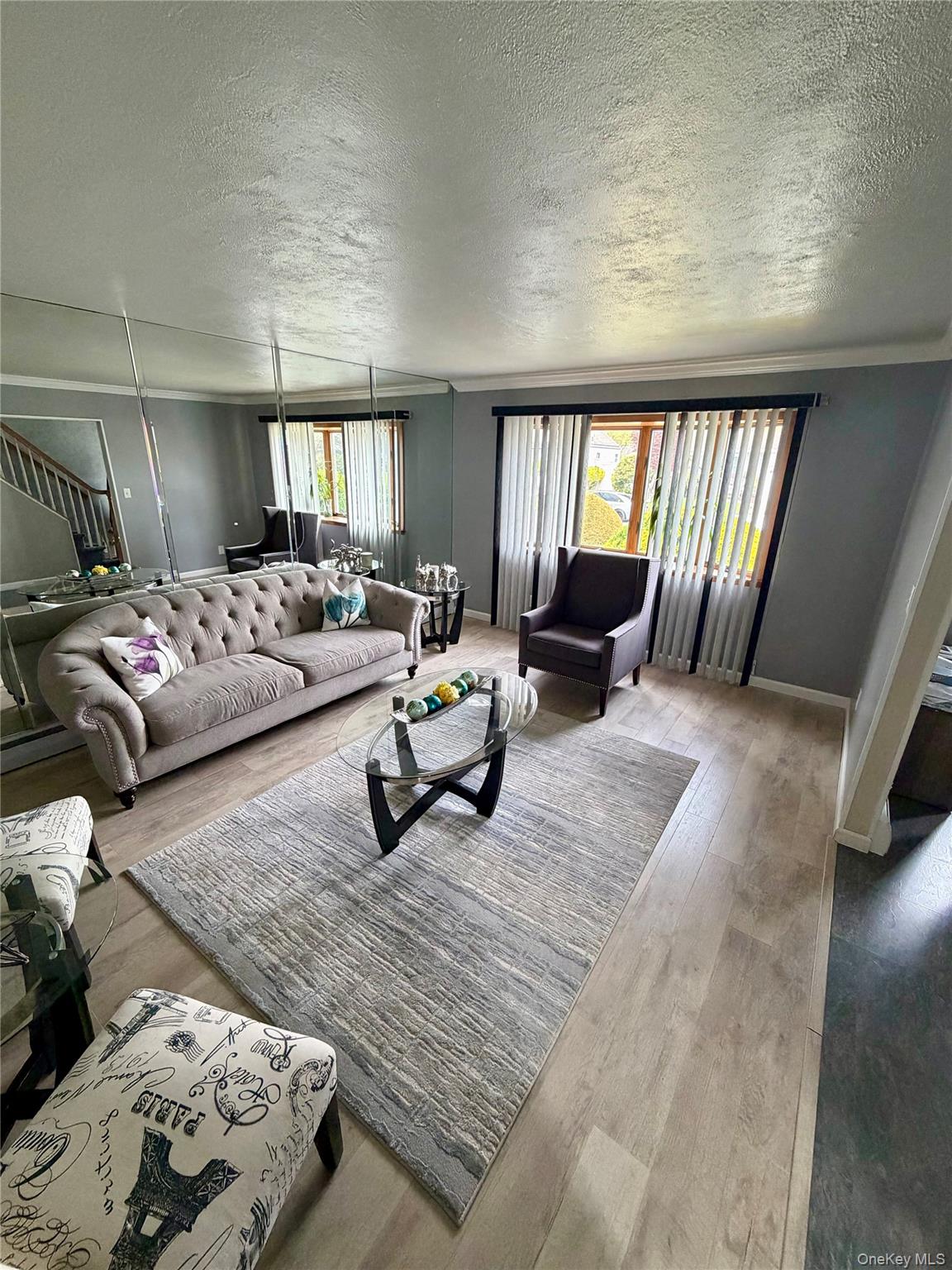 27 Colonial Road Copiague, NY 11726 - Photo 4 of 15 a living room with furniture and a large window