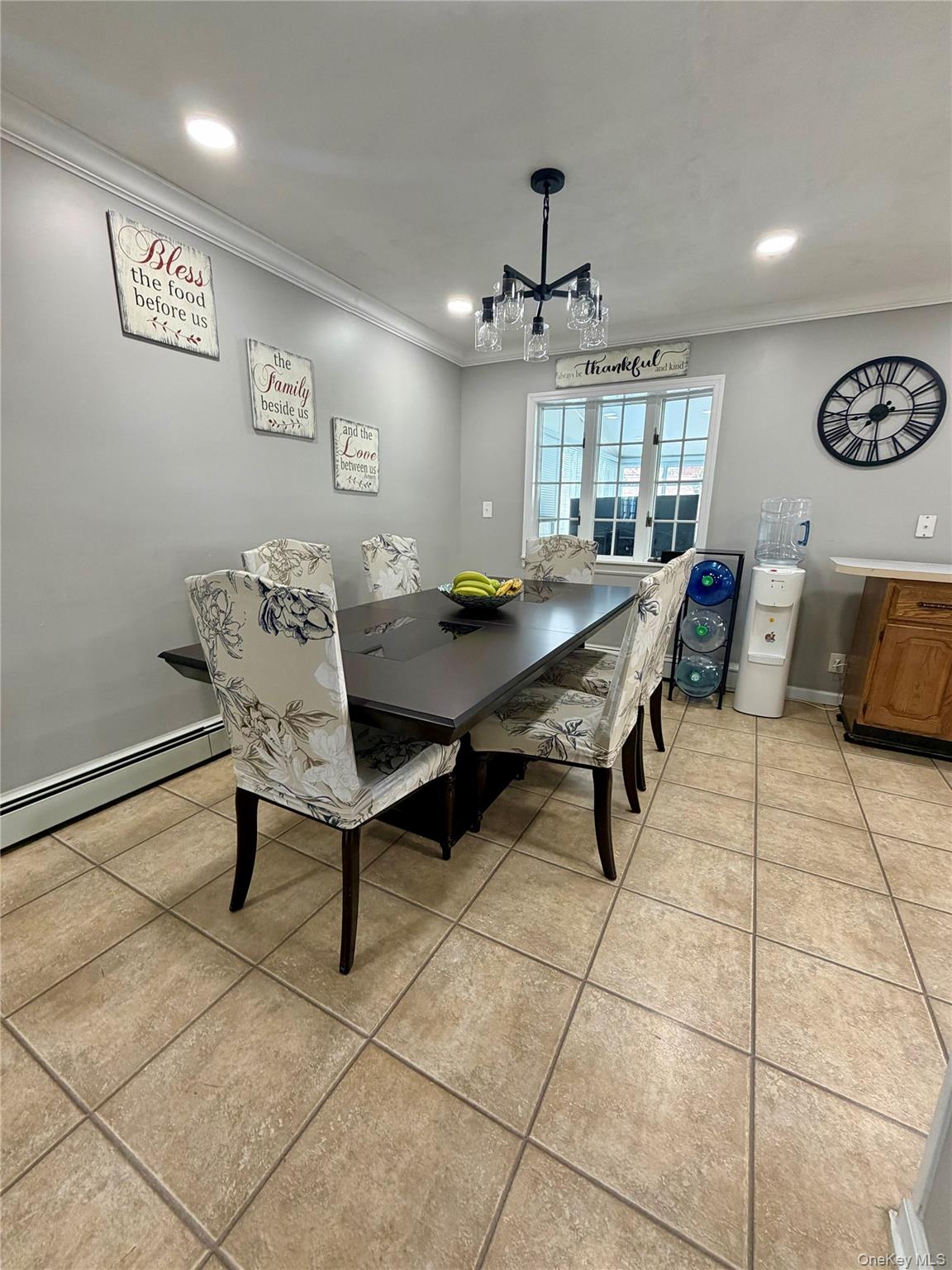 27 Colonial Road Copiague, NY 11726 - Photo 6 of 15 a view of a livingroom with furniture and a dining table