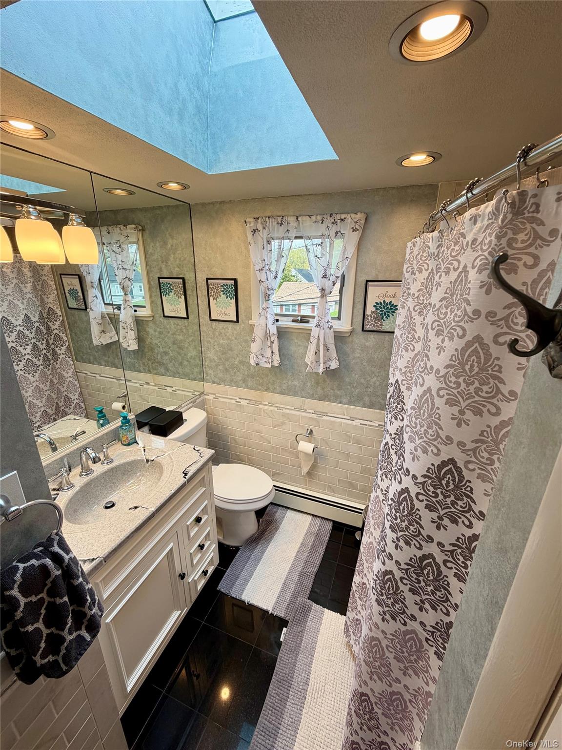 27 Colonial Road Copiague, NY 11726 - Photo 8 of 15 a bed room with a bed and a couch