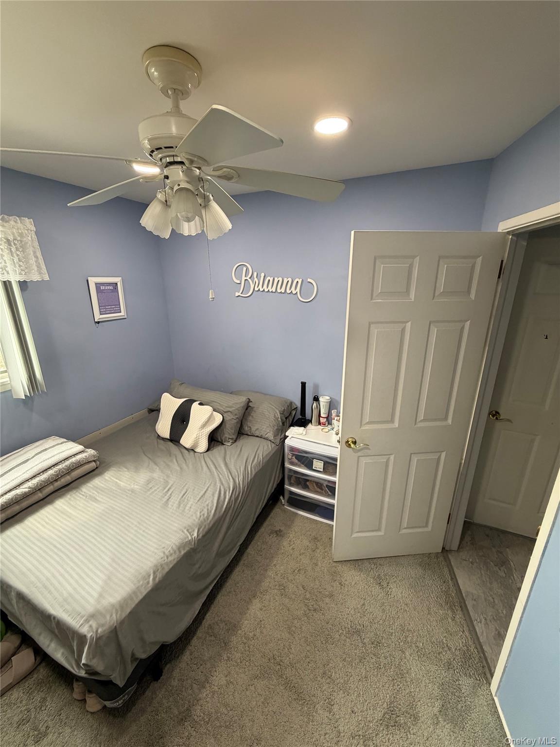 27 Colonial Road Copiague, NY 11726 - Photo 9 of 15 a bedroom with a bed and a window