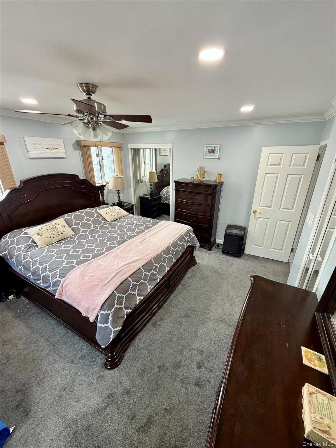 27 Colonial Road Copiague, NY 11726 - Photo 10 of 15 a bedroom with a bed and a couch