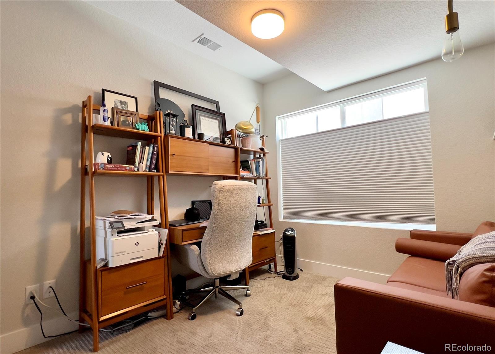 6228 West 38th Avenue Wheat Ridge, CO 80033 - Photo 27 of 38 a view of a workspace with furniture and a window