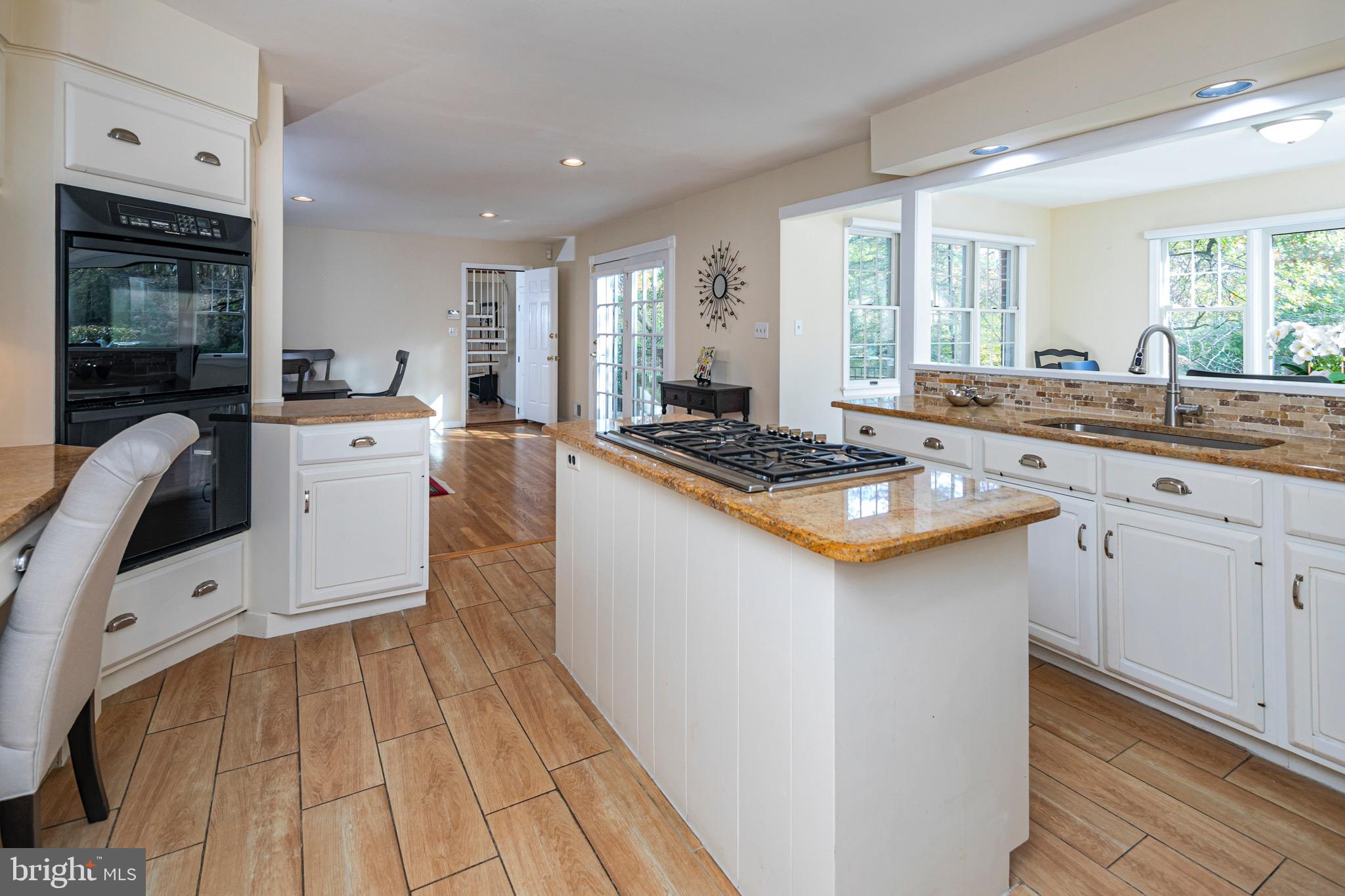8 Winfield Road Princeton, NJ 08540 - Photo 13 of 52 a kitchen with a sink stove and cabinets