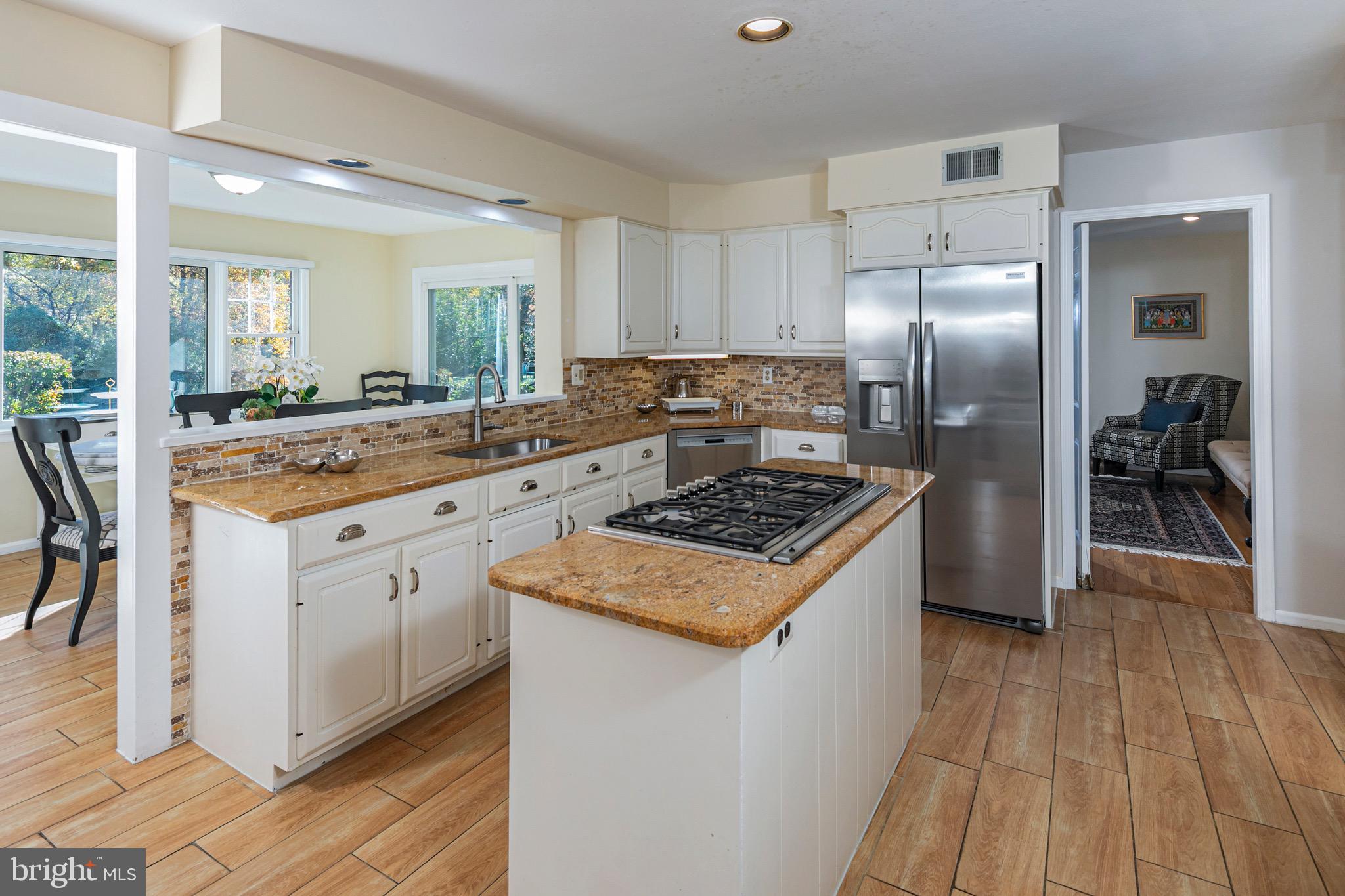 8 Winfield Road Princeton, NJ 08540 - Photo 14 of 52 a kitchen with stainless steel appliances granite countertop a stove and a refrigerator
