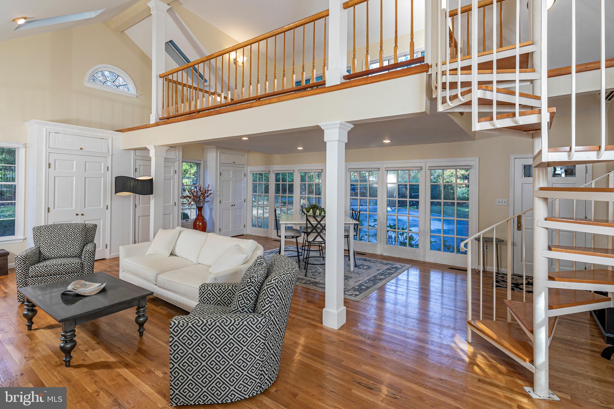8 Winfield Road Princeton, NJ 08540 - Photo 15 of 52 a living room with furniture a wooden floor and a large window
