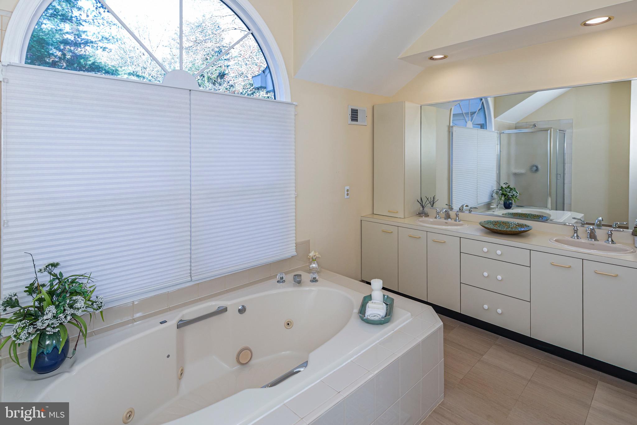 8 Winfield Road Princeton, NJ 08540 - Photo 37 of 52 a spacious bathroom with a double vanity sink a mirror and a bathtub