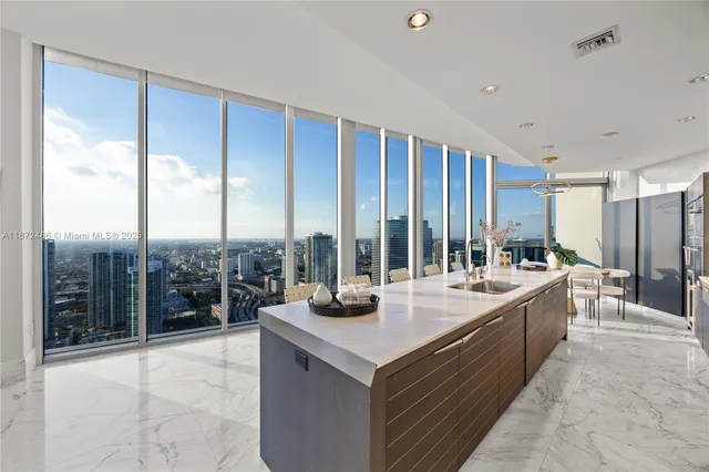 a living room with furniture and a painting on the wall