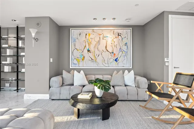 a bedroom with bed and a potted plant