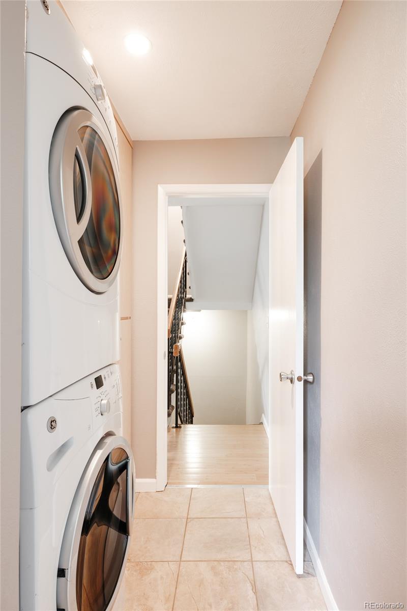 7448 West Roxbury Place Littleton, CO 80128 - Photo 15 of 30 a view of a hallway with washer and dryer