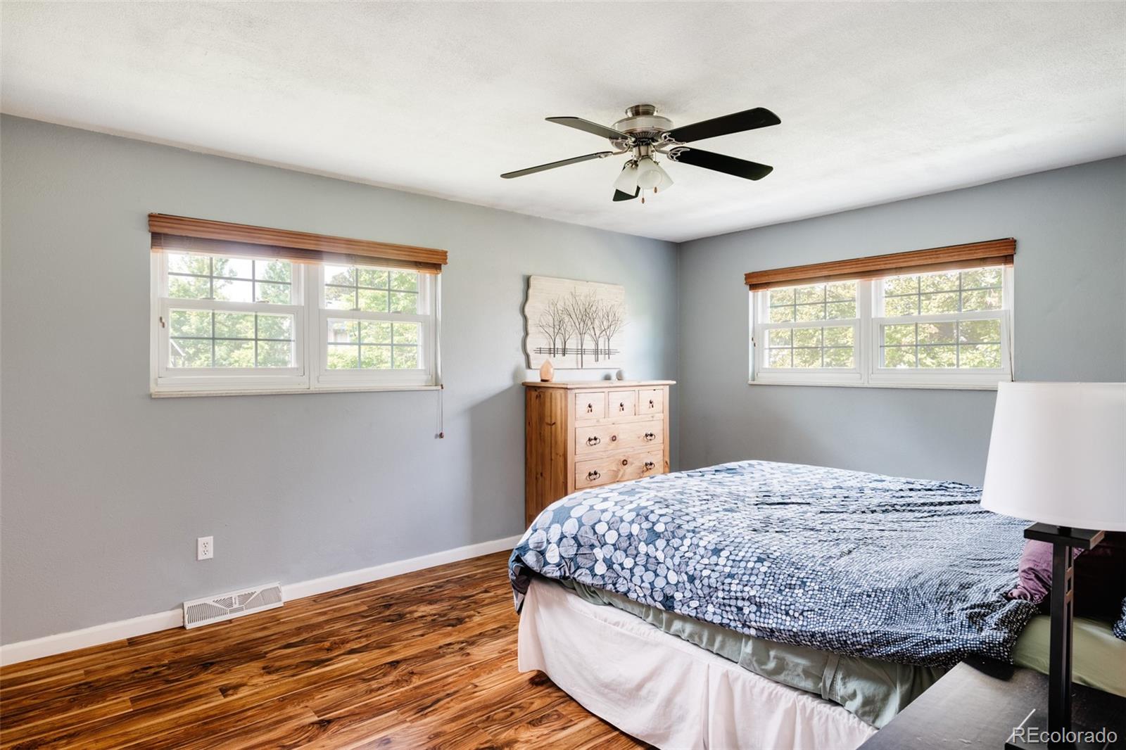 7448 West Roxbury Place Littleton, CO 80128 - Photo 16 of 30 a bedroom with a bed and window