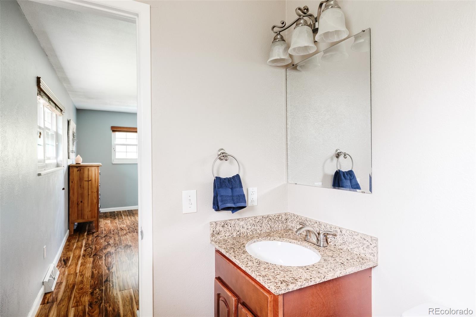 7448 West Roxbury Place Littleton, CO 80128 - Photo 19 of 30 a bathroom with a sink and a mirror