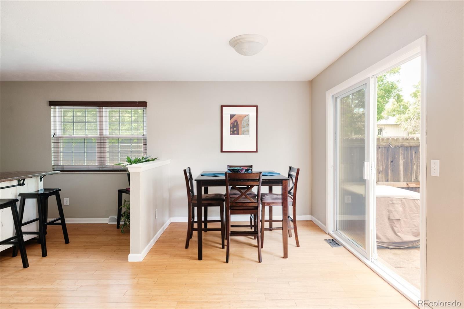 7448 West Roxbury Place Littleton, CO 80128 - Photo 5 of 30 a view of a dining room with furniture window and outside view