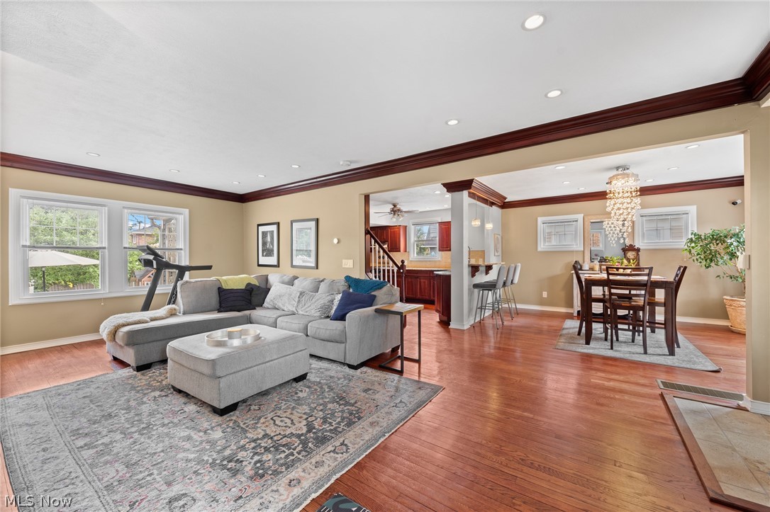 3625 Cedarbrook Road Cleveland, OH 44118 - Photo 2 of 15 Bright living room with gleaming wood floors, crown molding, and open concept exudes elegance and spaciousness.