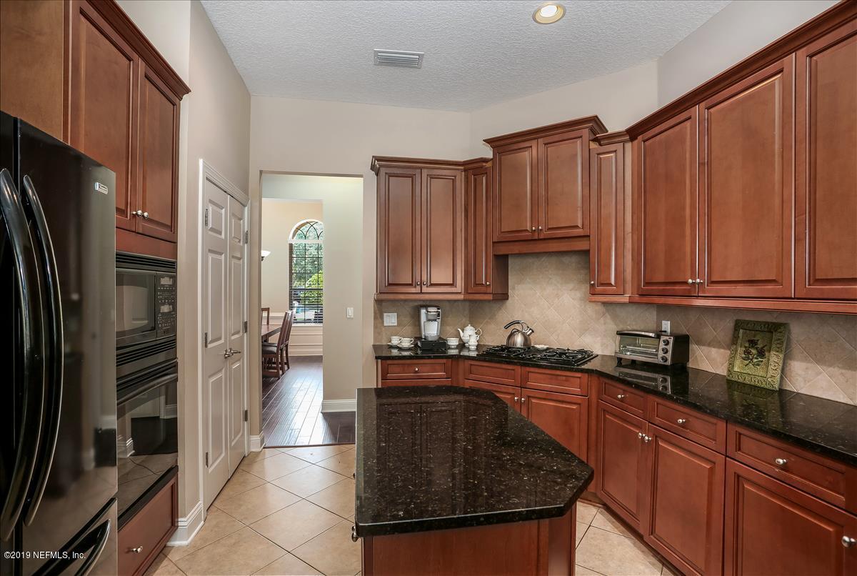 508 Sebastian Square St. Augustine, FL 32095 - Photo 14 of 46 a kitchen with stainless steel appliances granite countertop a refrigerator a sink a stove and oven